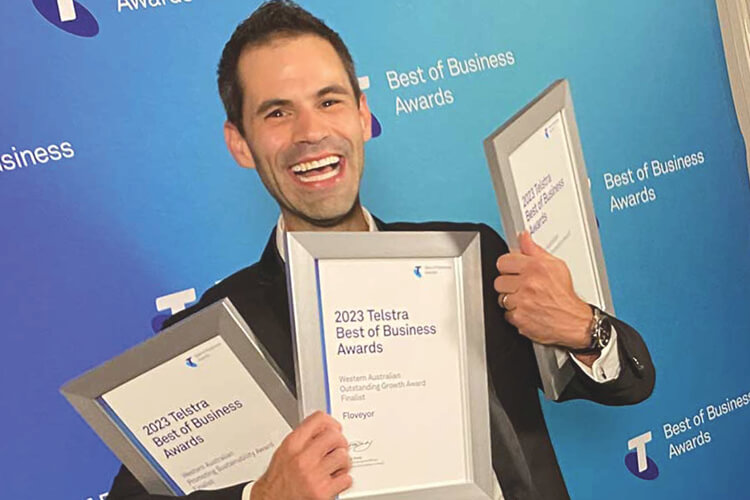 Rhys Walker MD proudly displaying Telstra Best of Business Finalist Awards