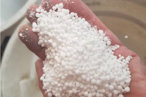 handful of urea held from a storage silo